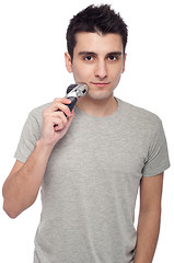 Image showing Young man shaving