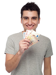 Image showing Man holding money