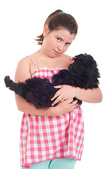 Image showing Girl holding dog