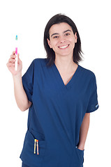 Image showing Dentist holding toothbrush