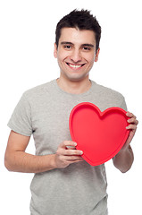 Image showing Casual man holding heart