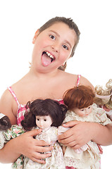 Image showing Little girl with dolls