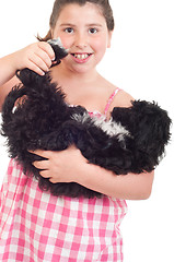 Image showing Girl playing with dog