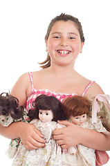 Image showing Little girl with dolls