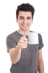 Image showing Man holding mug