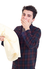 Image showing Man in pajamas holding pillow