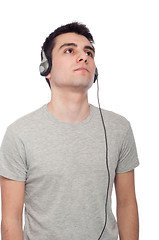 Image showing Casual man listening music