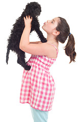 Image showing Girl kissing dog