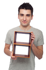 Image showing Man holding frame