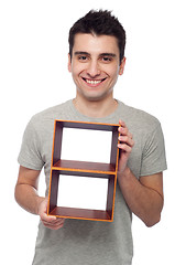 Image showing Man holding frame