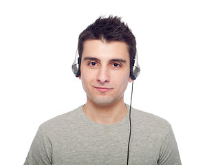 Image showing Casual man listening music