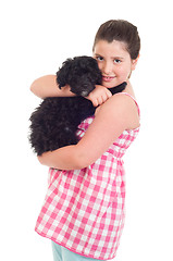 Image showing Girl holding dog