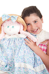 Image showing Little girl with doll