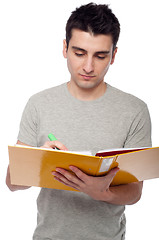 Image showing Man studying with dossier