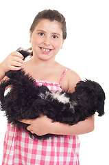 Image showing Girl playing with dog