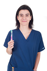 Image showing Dentist holding toothbrush