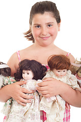 Image showing Little girl with dolls