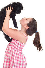 Image showing Girl kissing dog