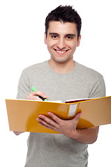 Image showing Man studying with dossier