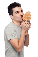 Image showing Man kissing teddy bear