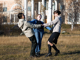 Image showing Three girls dancing 