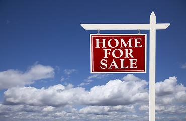 Image showing Red Home For Sale Real Estate Sign Over Clouds and Sky