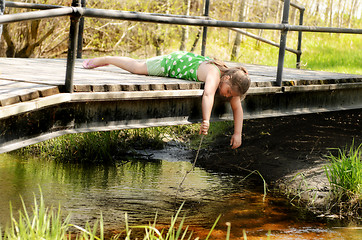 Image showing Girl Playing On Bridge