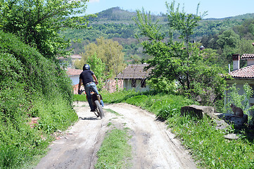 Image showing Riding Motorbike Down Country Road