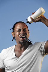 Image showing Young athletic man taking a break 