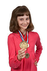 Image showing Girl shows gold medal