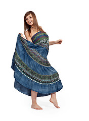 Image showing beautiful girl in jeans sarafan dancing
