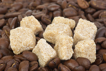 Image showing Few pieces of brown sugar over the coffee beans