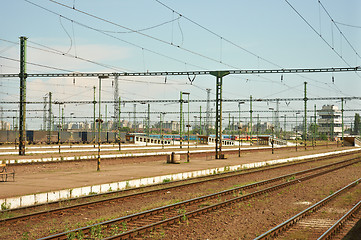 Image showing Old train station with rails and cables