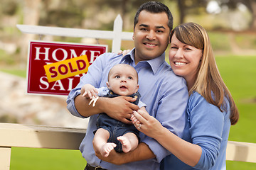 Image showing Mixed Race Couple, Baby, Sold Real Estate Sign