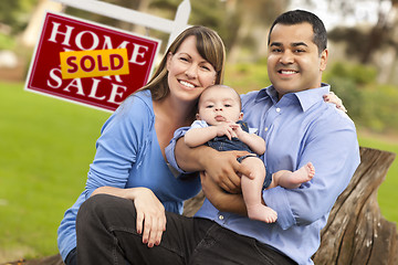 Image showing Mixed Race Couple, Baby, Sold Real Estate Sign