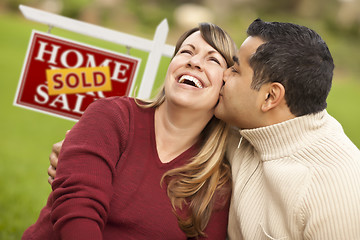Image showing Mixed Race Couple in Front of Sold Real Estate Sign
