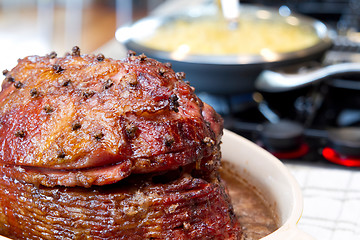 Image showing Spiral Cut Hickory Smoked Ham on Cooking Stove Top