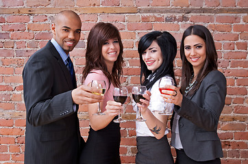 Image showing Smiling young people with glasses of wine