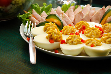 Image showing eggs and pork on table