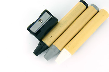 Image showing Black, grey and white crayons on white