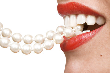 Image showing woman smiles showing white teeth and pearly necklace