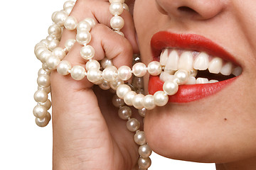 Image showing woman smiles showing white teeth and pearly necklace