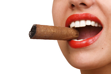 Image showing mouth with red lips biting a cigar