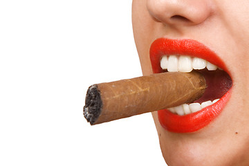 Image showing mouth with red lips biting a cigar