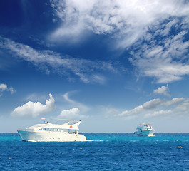 Image showing white boats sailing on turquoise sea