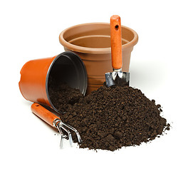 Image showing Pots, gardening tools and dirt