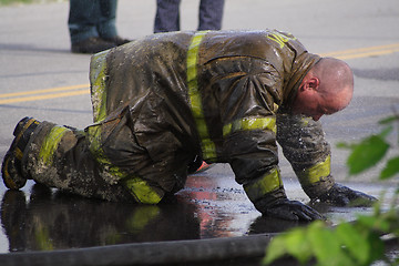 Image showing Fireman exausted