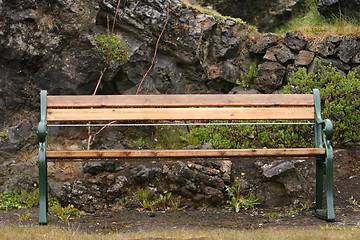 Image showing rainy garden bench
