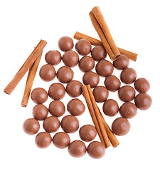 Image showing Chocolate balls and cinnamon sticks