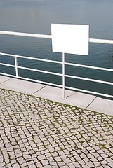 Image showing Empty sign near water